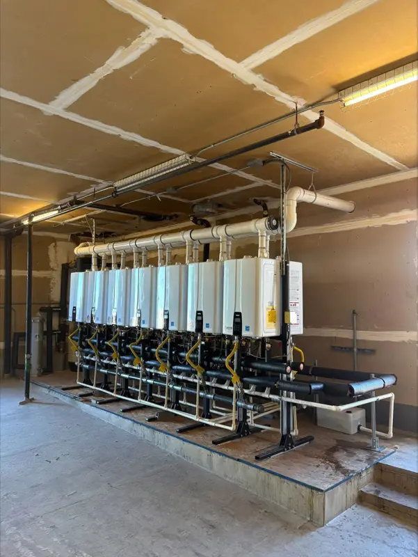 Bank of tankless water heaters on a commercial job
